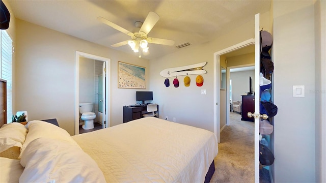 carpeted bedroom featuring connected bathroom and ceiling fan