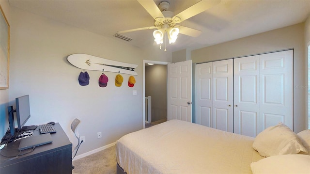 carpeted bedroom with a closet and ceiling fan