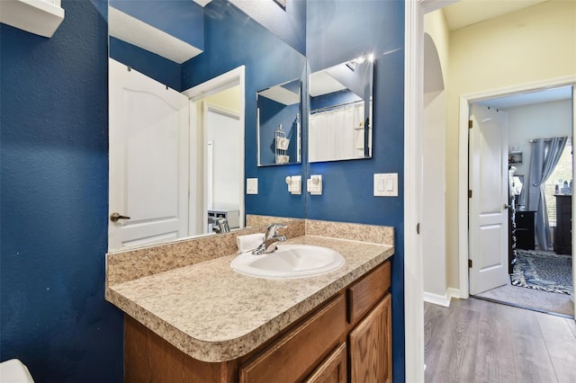 bathroom featuring vanity and wood-type flooring