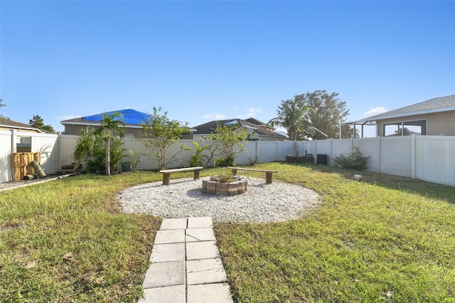 view of yard with an outdoor fire pit