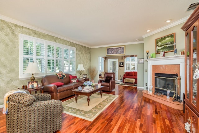 living room featuring ornamental molding, a high end fireplace, and dark hardwood / wood-style flooring