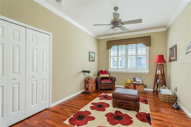 sitting room featuring crown molding, hardwood / wood-style flooring, and ceiling fan