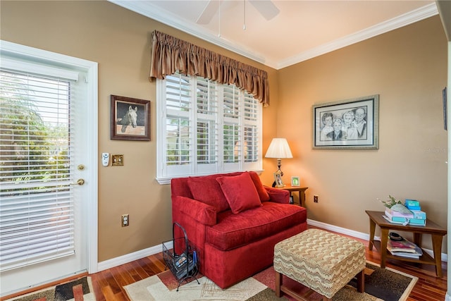 living room with crown molding, hardwood / wood-style flooring, and ceiling fan