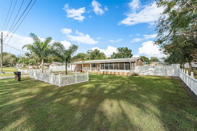 view of yard with a sunroom