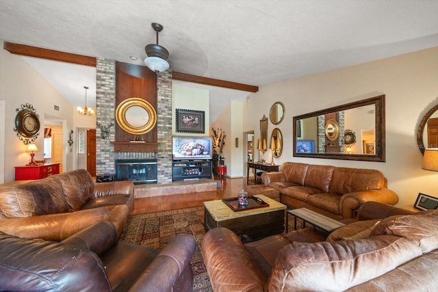 living room featuring vaulted ceiling with beams, hardwood / wood-style flooring, a brick fireplace, a chandelier, and a textured ceiling