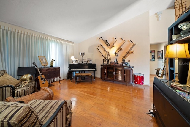 living room with lofted ceiling and light hardwood / wood-style floors