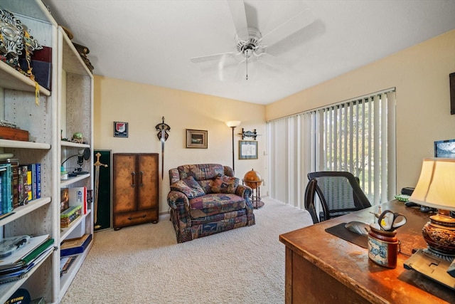 office featuring light carpet and ceiling fan