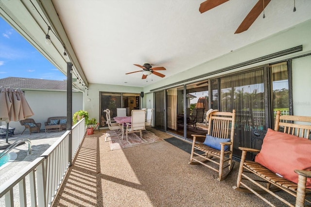 view of patio featuring ceiling fan