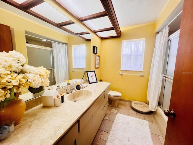 bathroom featuring toilet, walk in shower, vanity, and tile patterned floors