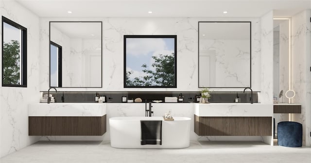 bathroom with vanity and a bathing tub