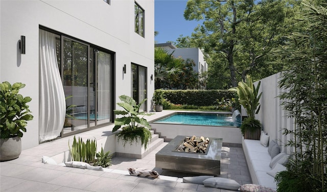 view of pool with a patio and a fire pit