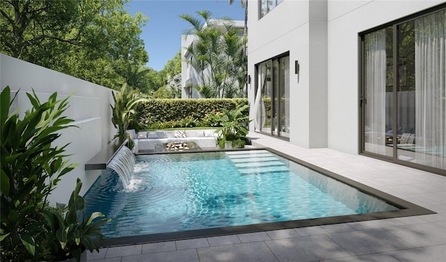 view of swimming pool featuring a patio and pool water feature