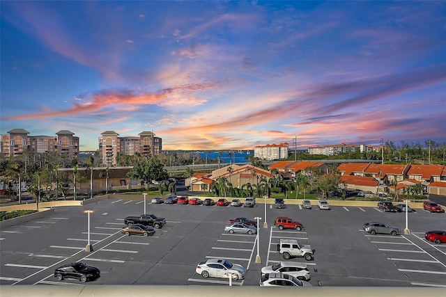 view of parking at dusk