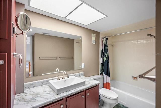 full bathroom featuring vanity, toilet, and shower / tub combo