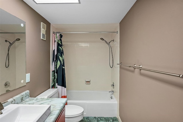 full bathroom with vanity, shower / bath combo with shower curtain, and toilet