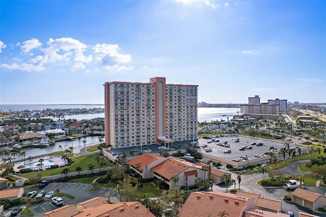 birds eye view of property with a water view