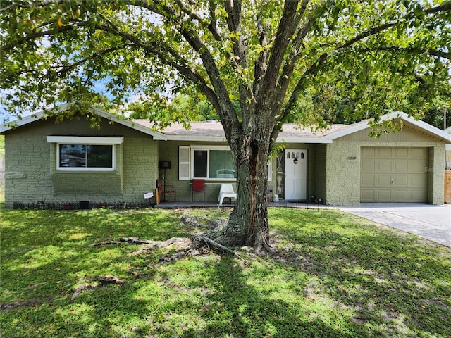 ranch-style home with a front yard and a garage