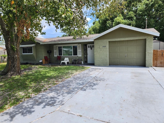 ranch-style house with a front yard and a garage