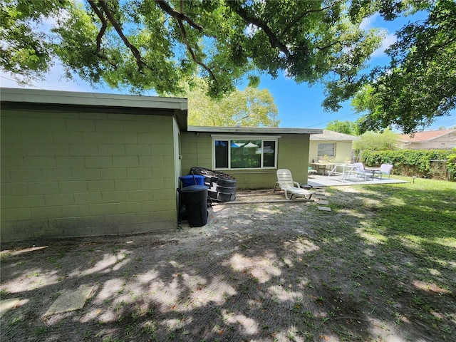 back of house with a patio