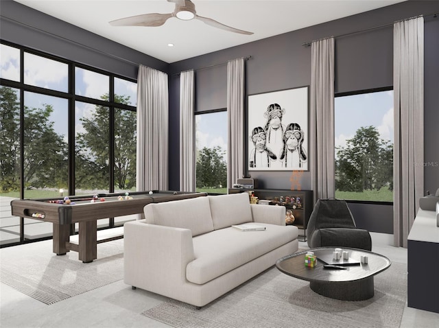 interior space featuring pool table, ceiling fan, and plenty of natural light