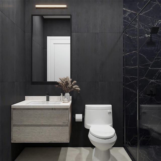 bathroom with toilet, a shower, vanity, and tile walls