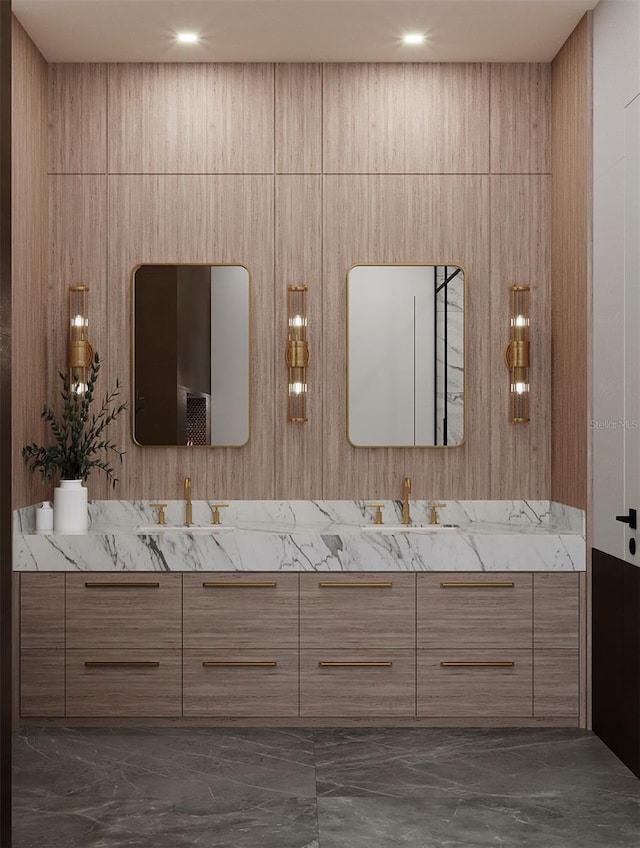 bathroom featuring wooden walls and vanity