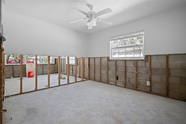 interior space featuring a textured ceiling and ceiling fan