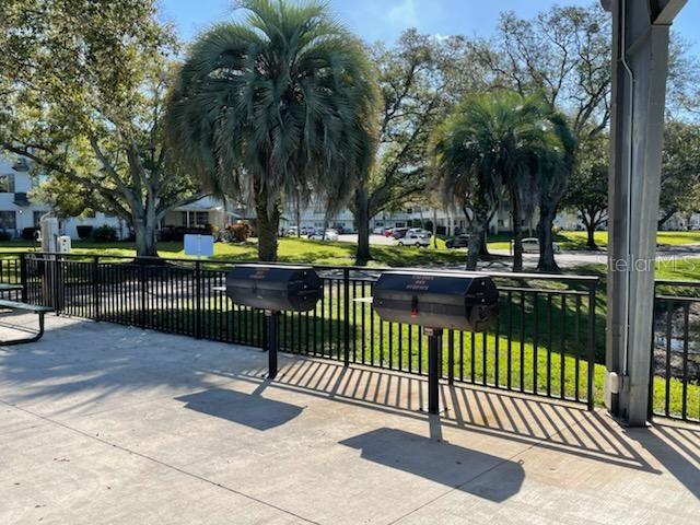 view of gate featuring a lawn