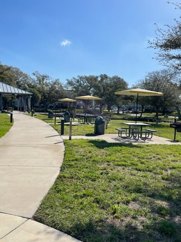 surrounding community with a gazebo and a lawn