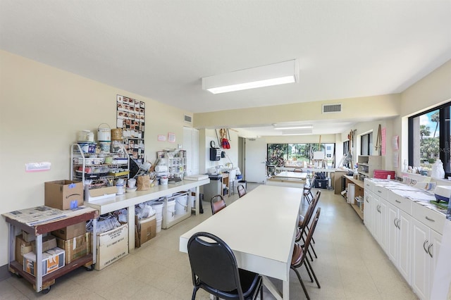 kitchen with kitchen peninsula and white cabinets