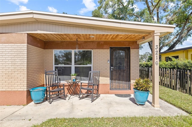 property entrance with a patio