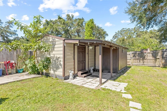 view of outdoor structure with a lawn