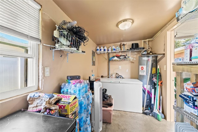 clothes washing area with water heater