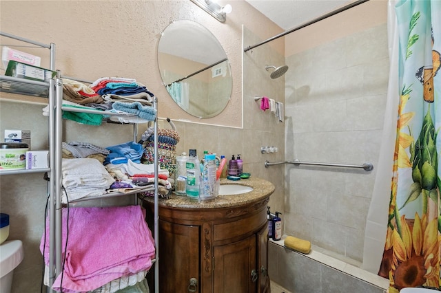 bathroom with vanity, toilet, and walk in shower