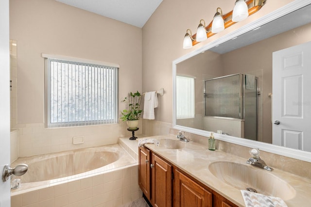 bathroom with independent shower and bath and vanity