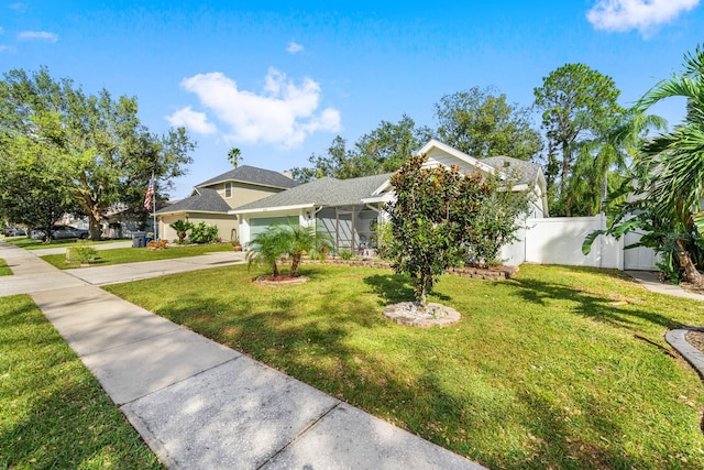 view of front of house featuring a garage and a front yard