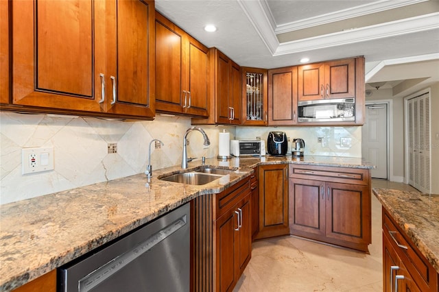 kitchen featuring tasteful backsplash, appliances with stainless steel finishes, sink, and ornamental molding