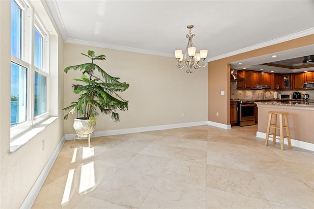 interior space with crown molding and a chandelier