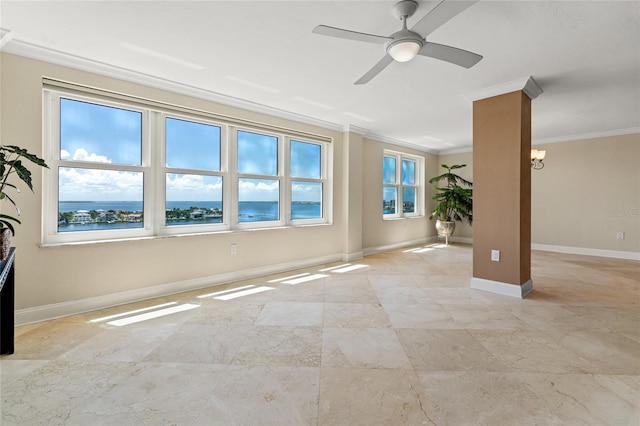 spare room featuring crown molding, ceiling fan, a water view, and plenty of natural light