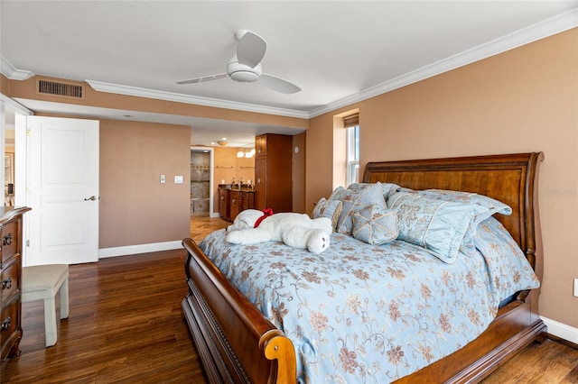 bedroom featuring ornamental molding, ensuite bath, dark wood-type flooring, and ceiling fan