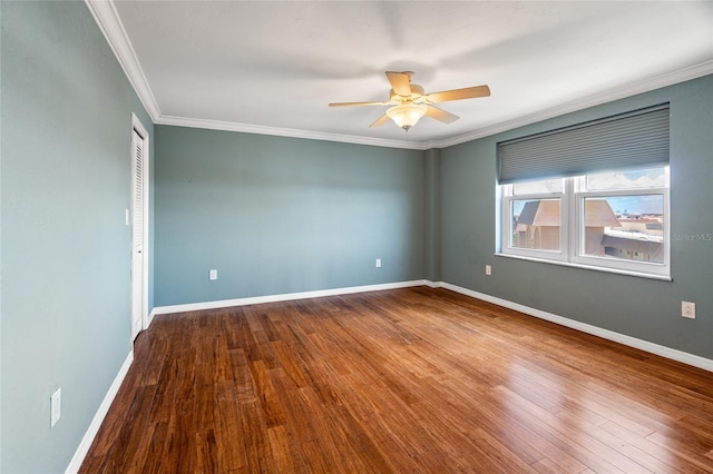 unfurnished room featuring crown molding, wood-type flooring, and ceiling fan