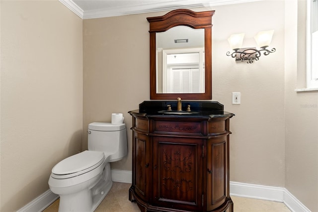 bathroom featuring vanity, toilet, ornamental molding, and tile patterned flooring