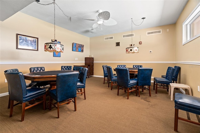 dining room featuring ceiling fan and carpet flooring