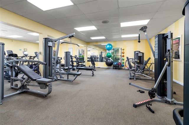 workout area with a paneled ceiling