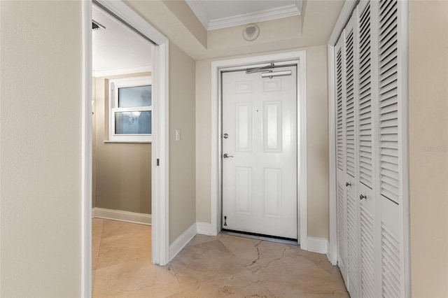5200 Brittany Dr S Unit 1202, Saint Petersburg, FL 33715 - foyer featuring light marble finish flooring, ornamental molding, and a tray ceiling