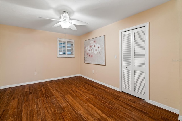 5200 Brittany Dr S Unit 1202, Saint Petersburg, FL 33715 - unfurnished bedroom featuring dark wood-style flooring, a closet, and ceiling fan