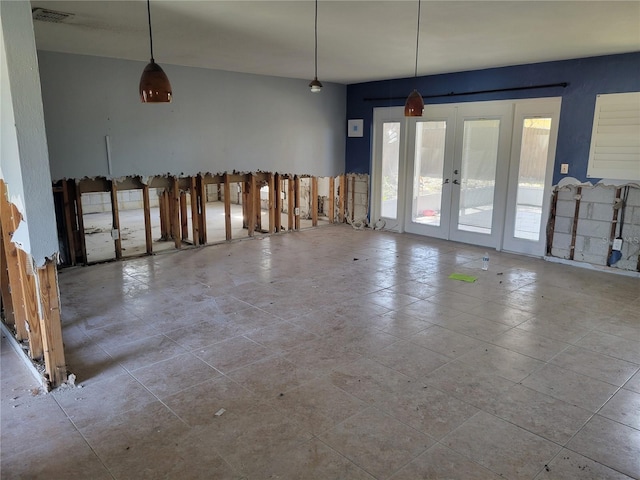 unfurnished dining area featuring french doors