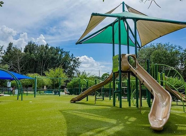 view of play area featuring a lawn