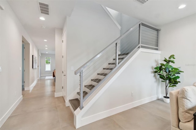 stairs with concrete floors