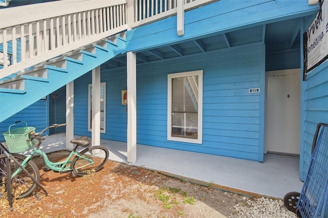 view of exterior entry with a porch